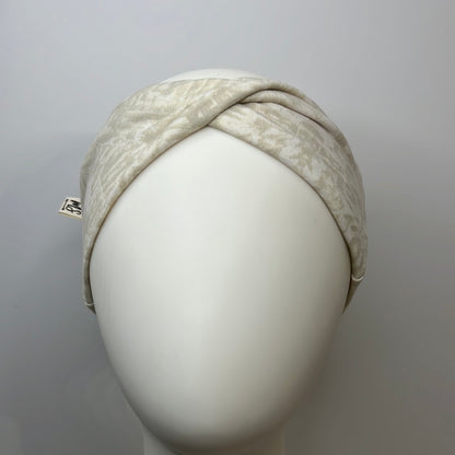 Light Beige with white headband.