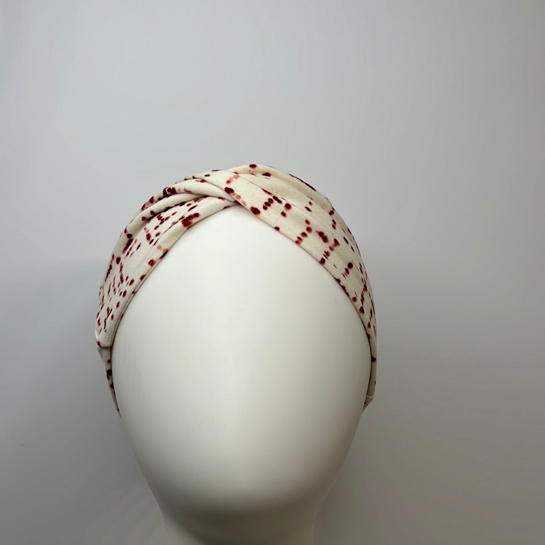 White with red dots headband.