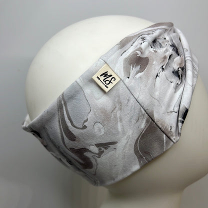 White with light brown, and gray tones headband.