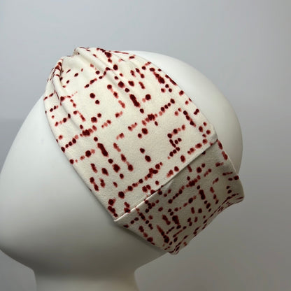 White with red dots headband.