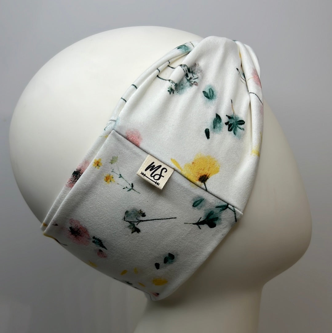 White with flowers headband.