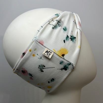 White with flowers headband.