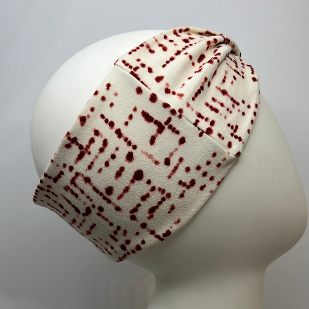 White with red dots headband.